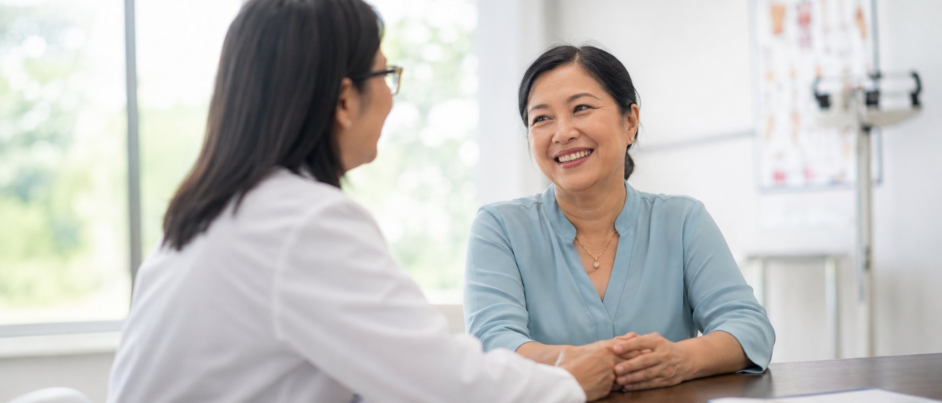 A patient smiling during a consultation at the clinic
